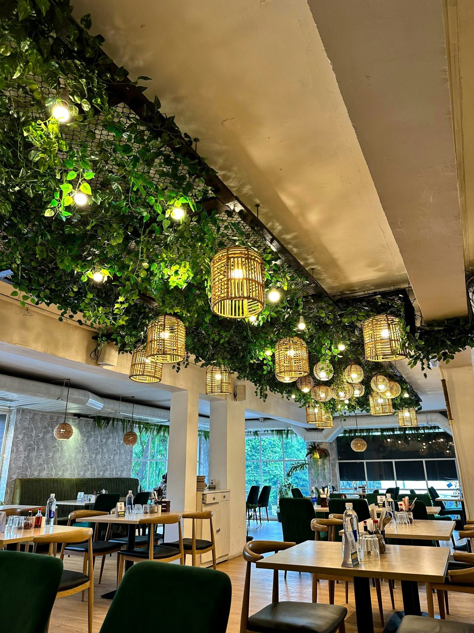 a restaurant filled with lots of tables and chairs